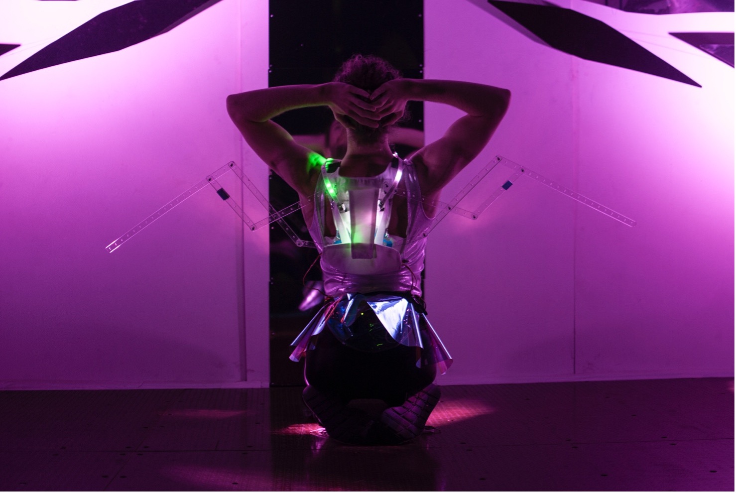 Babyface by Kate Ladenheim x The RAD Lab. Presented at the Performance Arcade in Wellington, NZ in February 2020. Performer Sebastian Geilings of Footnote New Zealand Dance, wearing a pair of breath-activated robotic wings. Photo by Colin Edson.